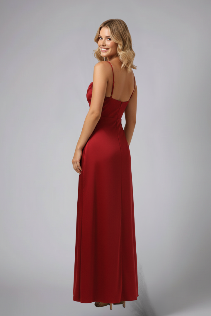 Female model front view in dress on plain gray background