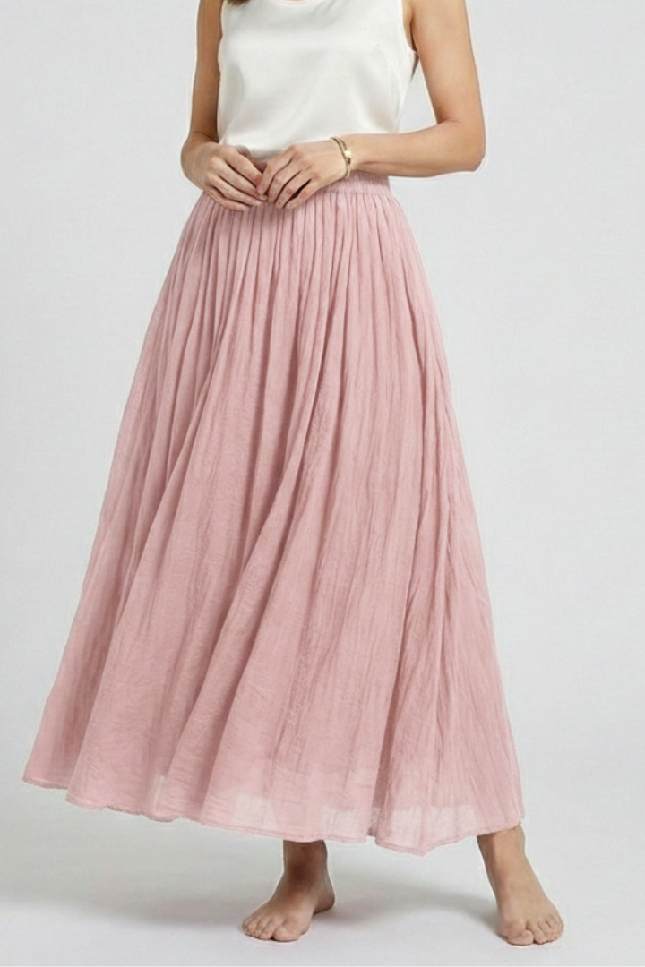 Model showcasing waistband detail pink skirt in gray-background