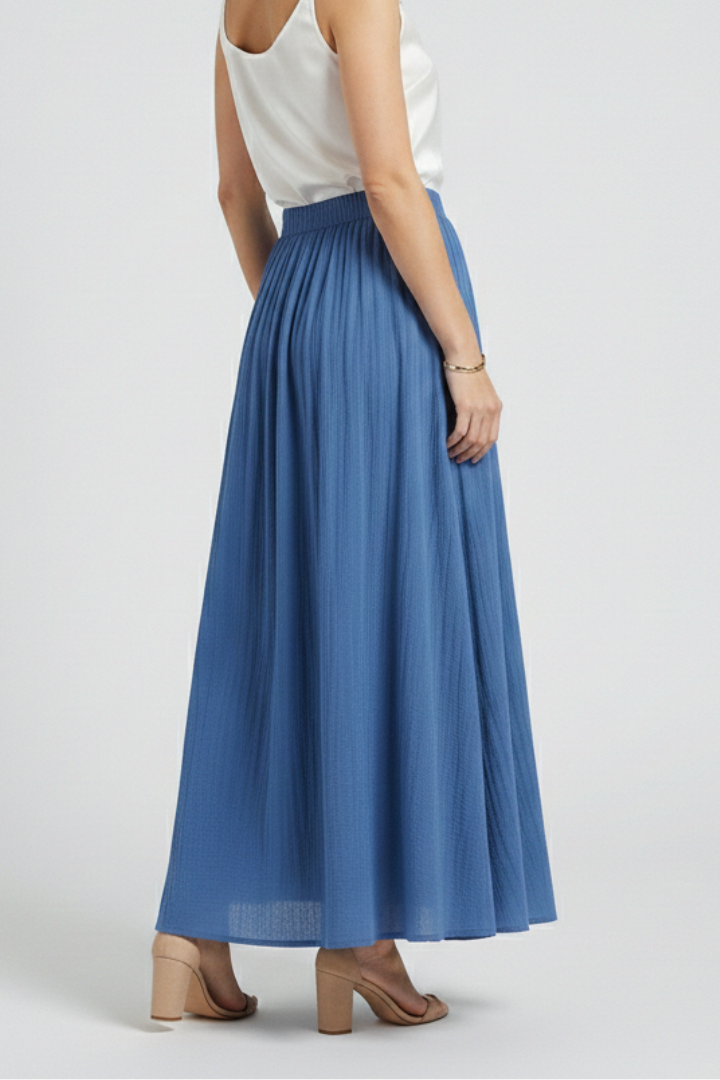 Model back view in long woven blue skirt in gray-background