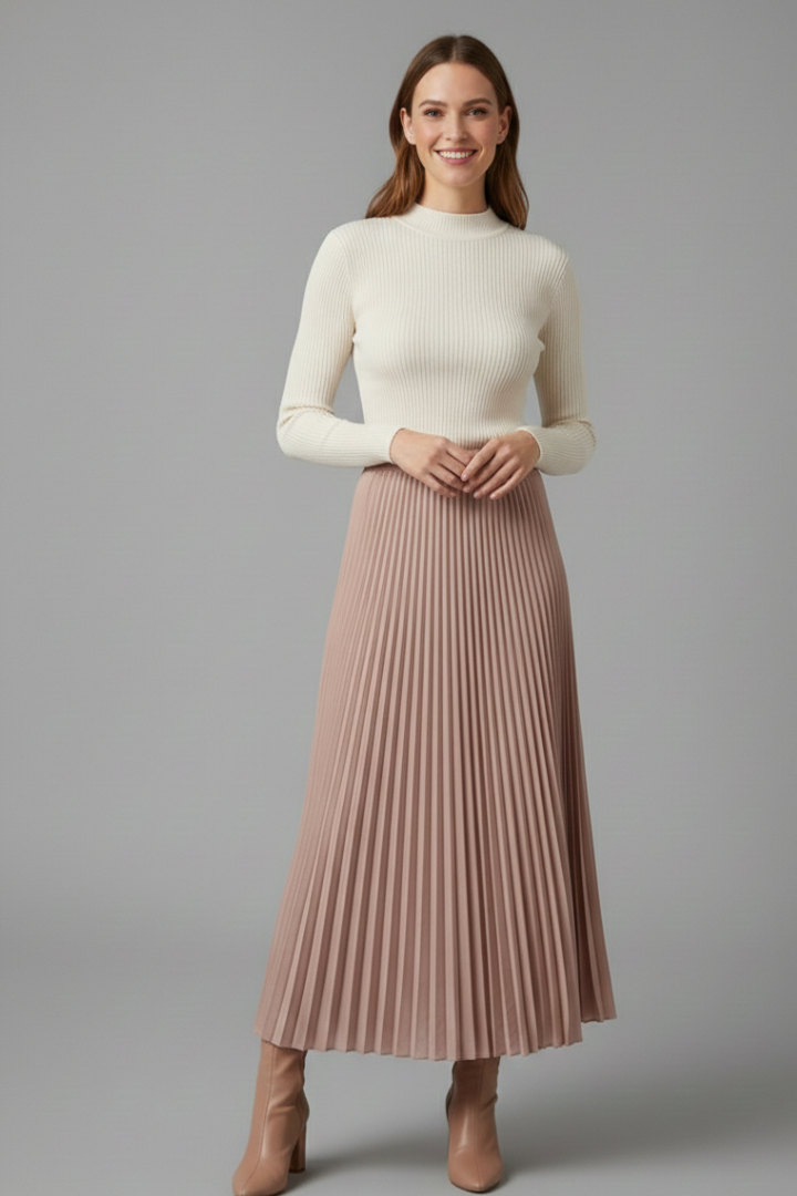 Model smiling wearing a full front length brown skirt on gray background