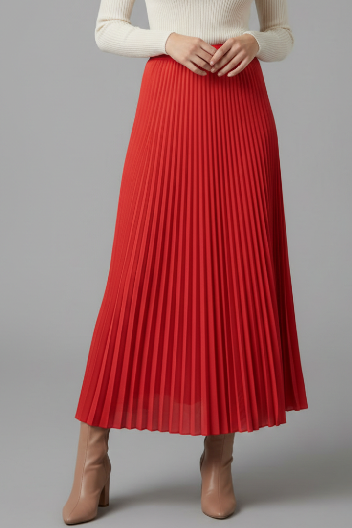 Front angle wide cut pleated red skirt gray background