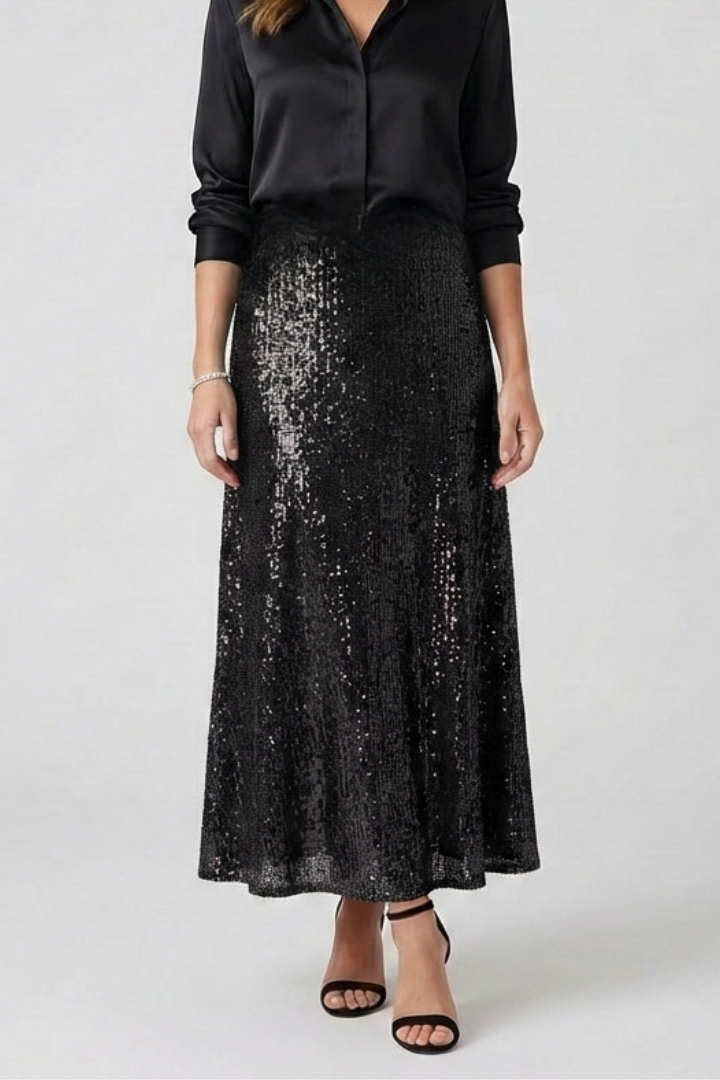 Model wearing pull on sequin skirt gray backdrop
