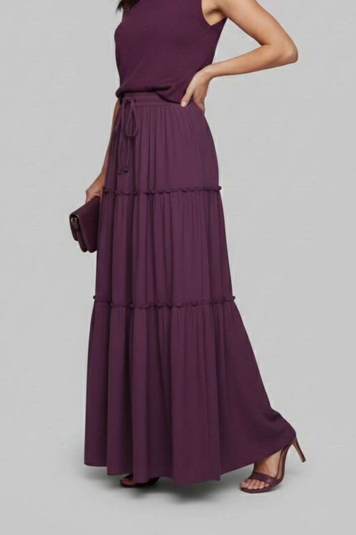 Side angle model with clutch and heels in elastic waist purple skirt