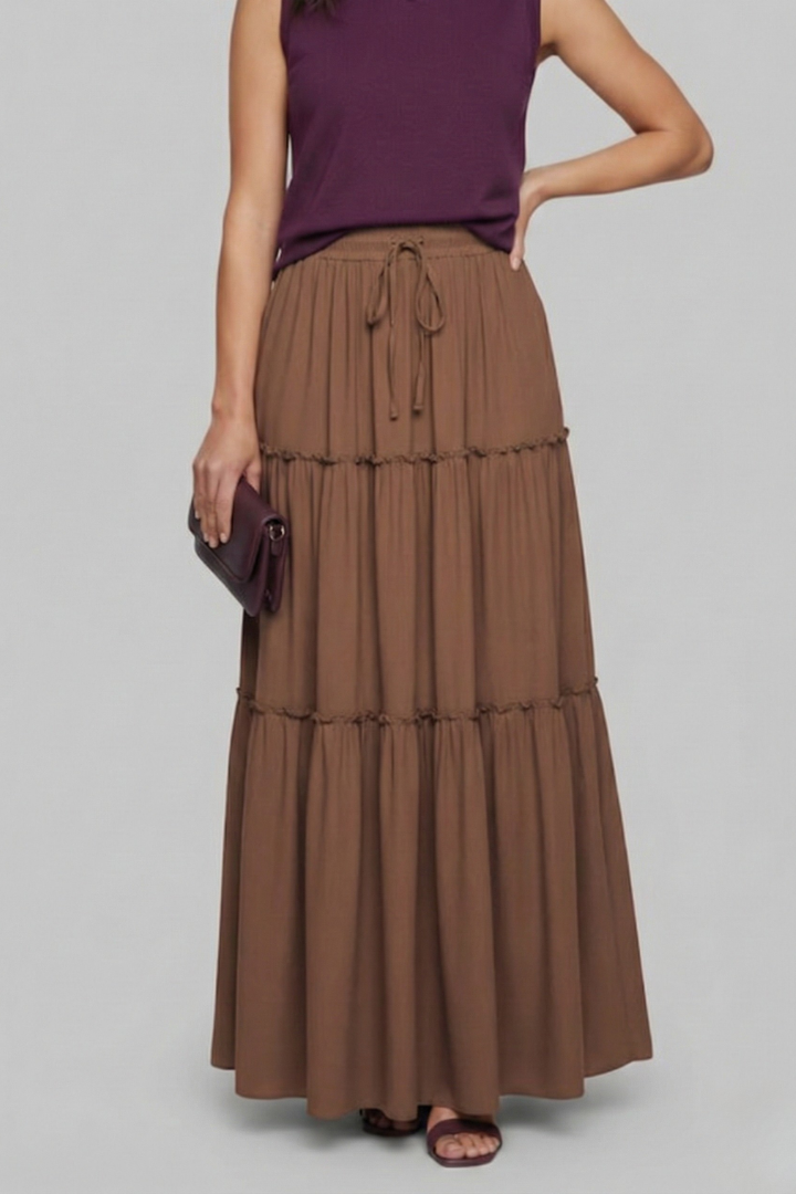 Tiered woven skirt modeled on gray background