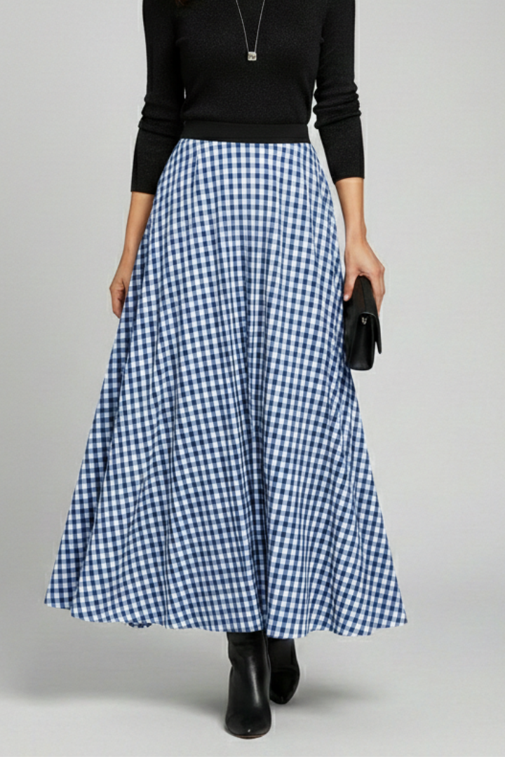 Fashion model in check skirt back view in gray backgroound