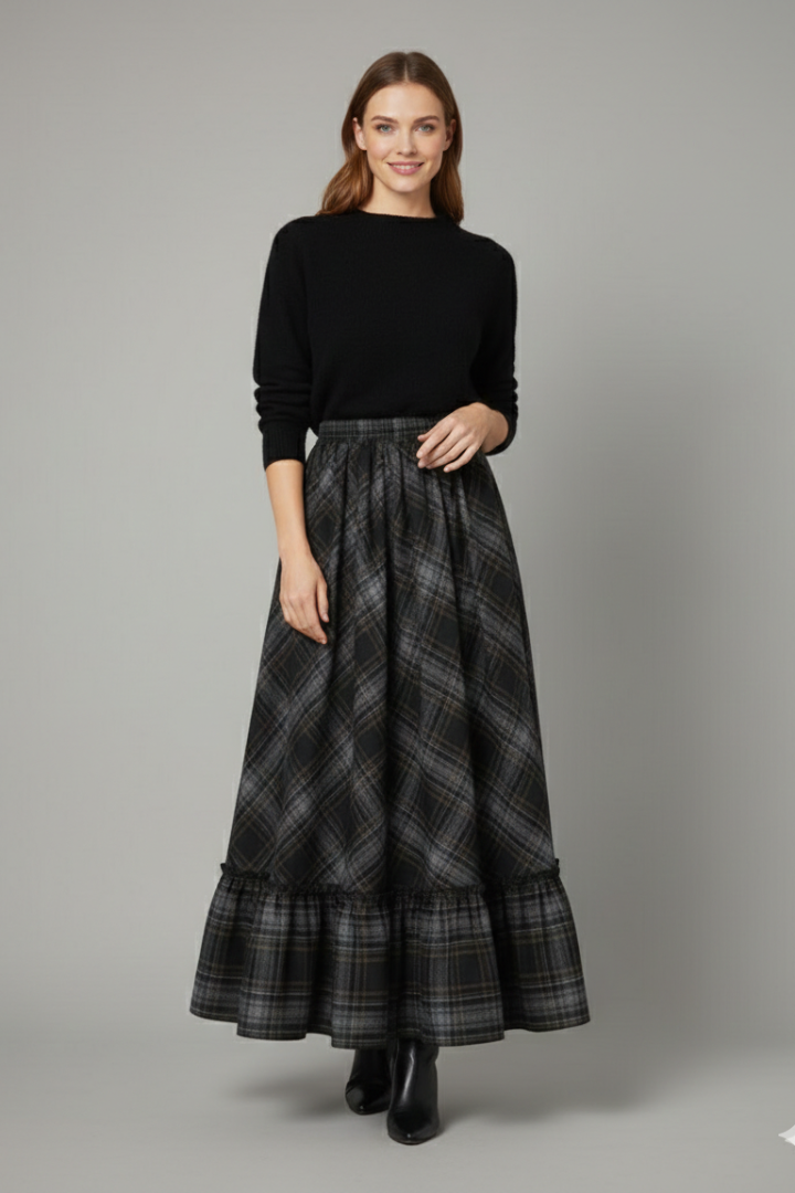 Model wearing plaid maxi skirt front view in gray background