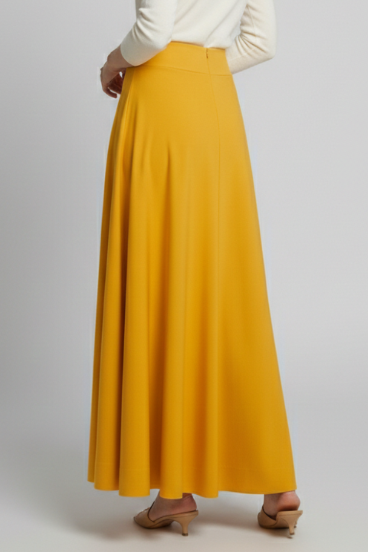 Back view of flowing yellow skirt on model gray