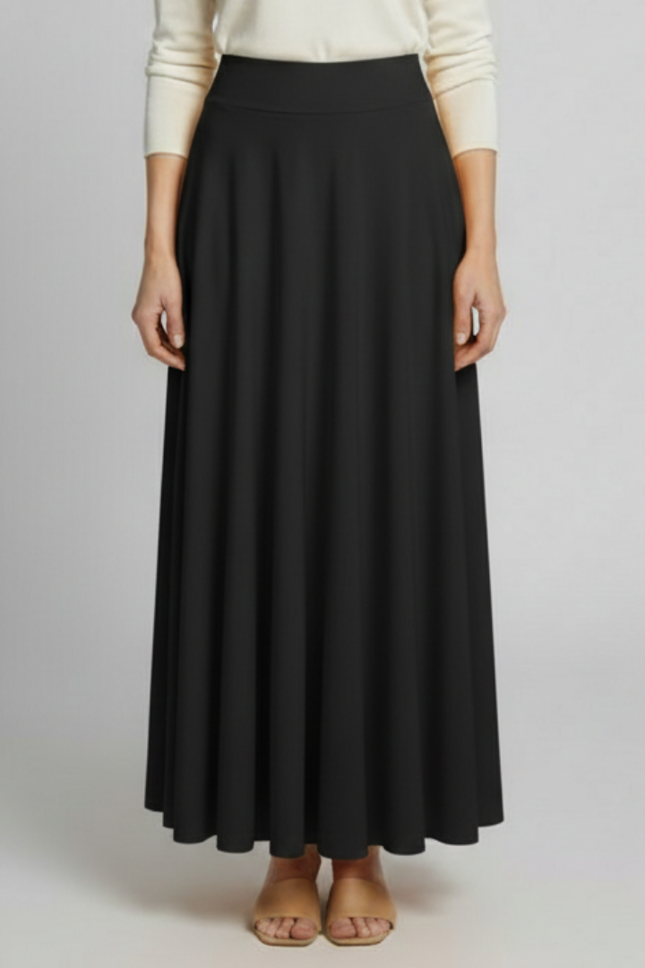 Model wearing elegant black long skirt and in white top