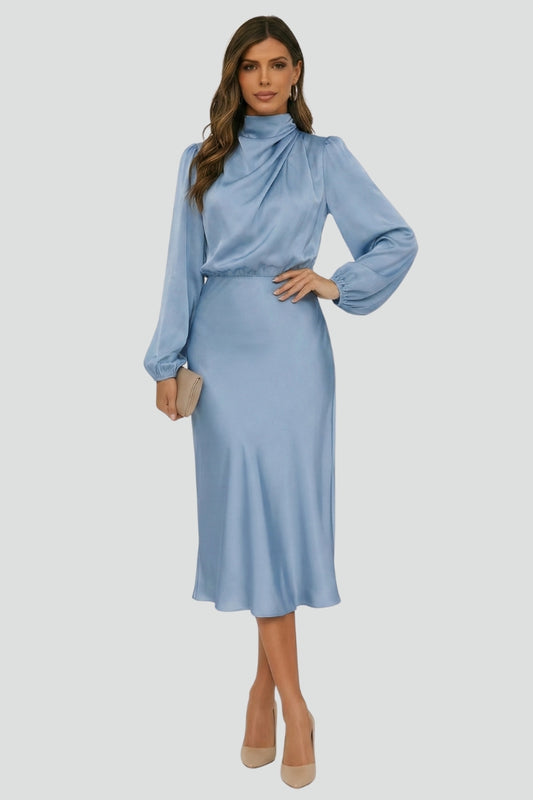 Female model displaying midi dress with draped neckline gray background.