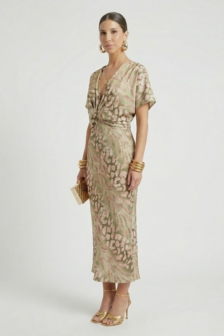 Side angle of pleated floral dress on model