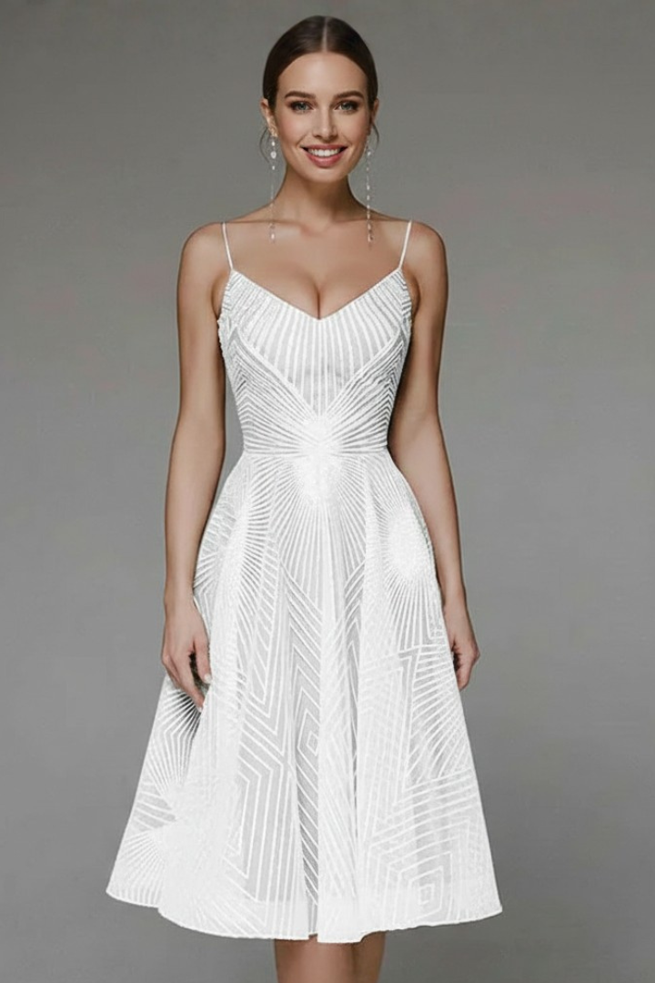 Model wearing flared midi dress against gray backdrop