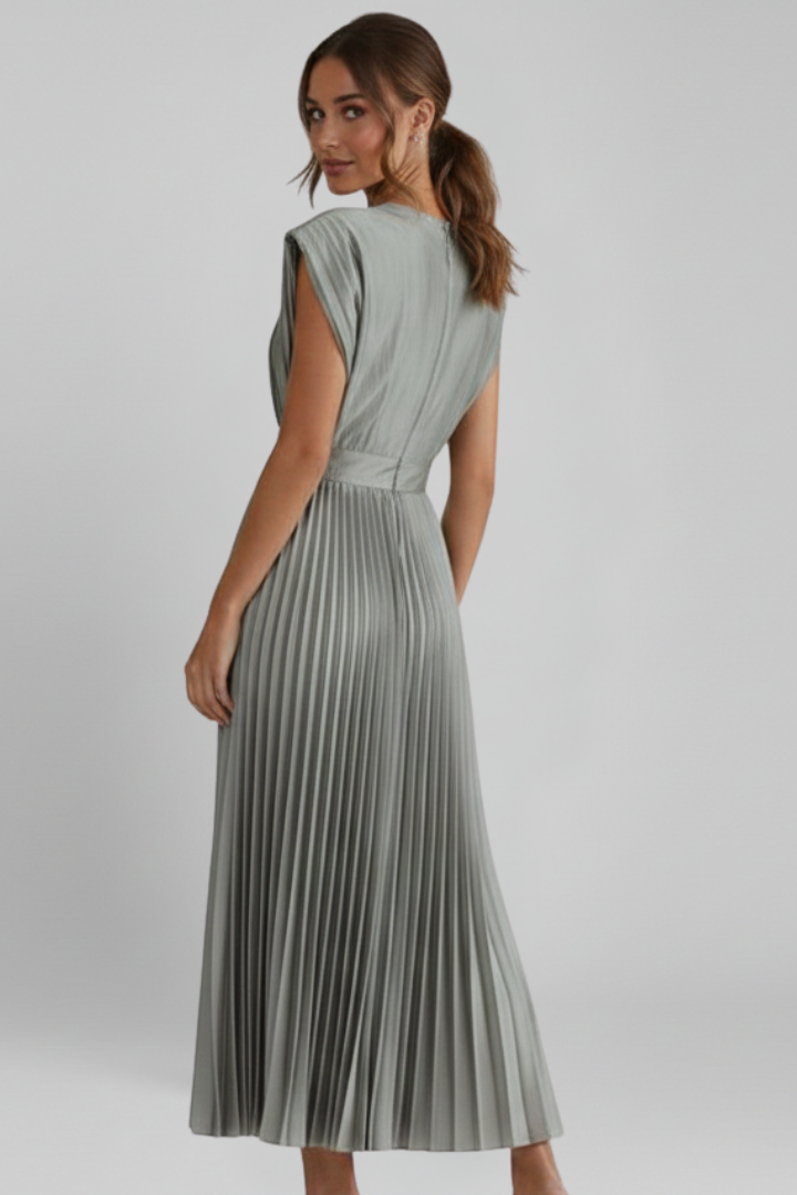 Back view of pleated midi dress gray background