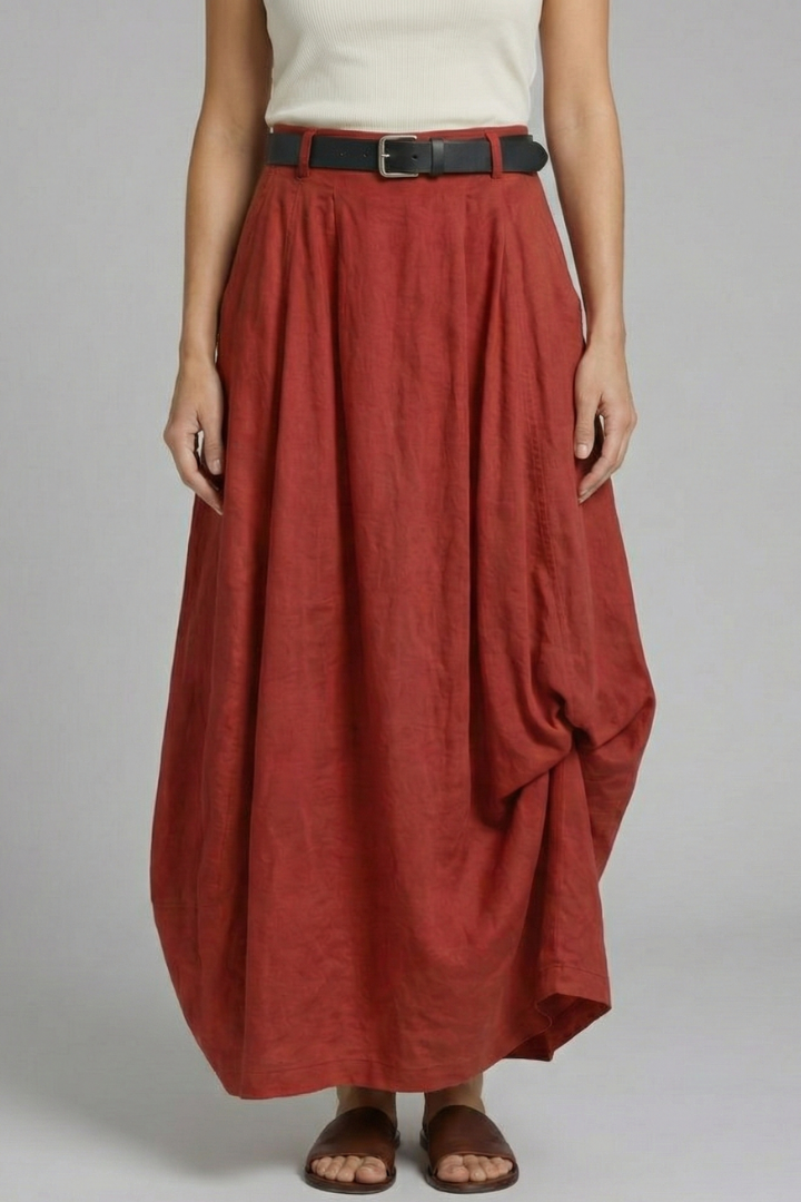 Model showcasing draped hem skirt side profile