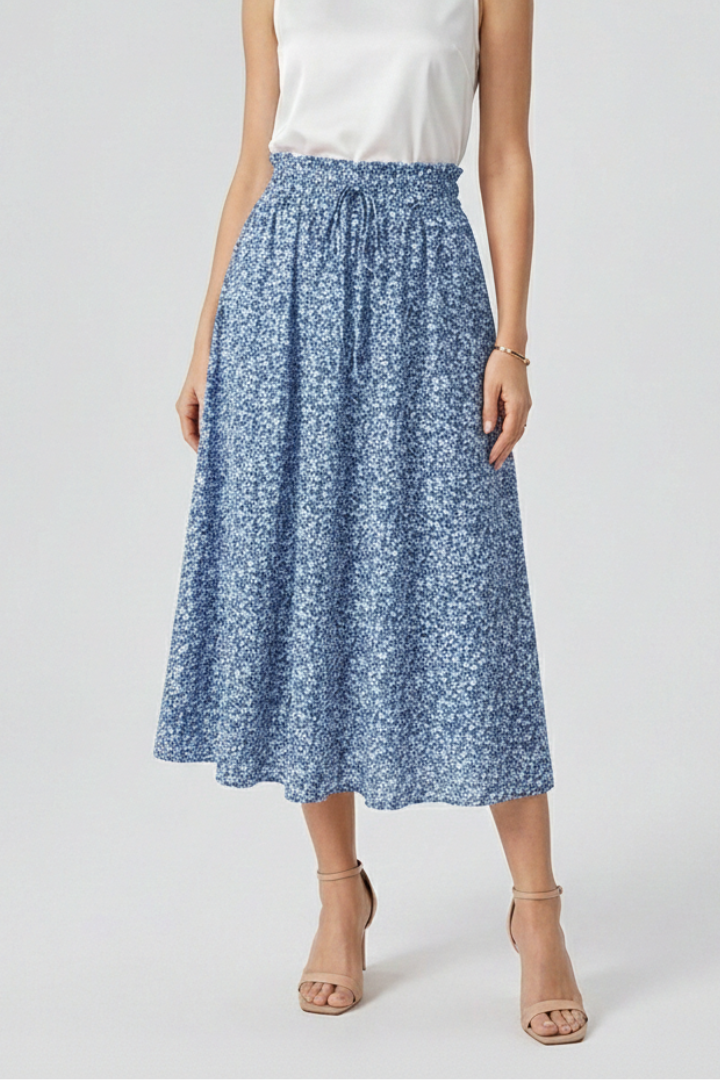 Female model in blue midi skirt side profile white background shot
