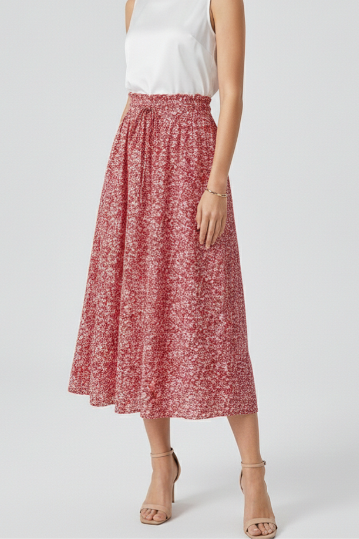 Cropped model in high rise waistband detail skirt and white top on white background