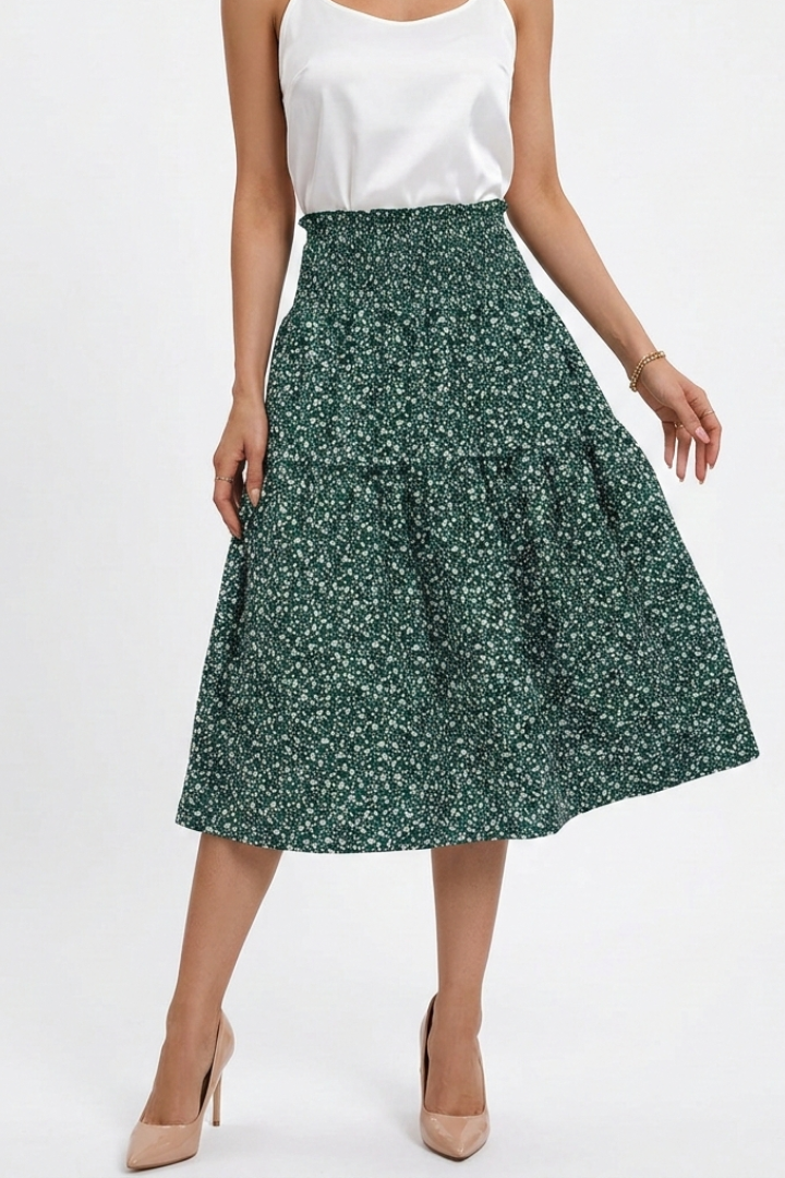 Model wearing floral skirt front pose in green skirt