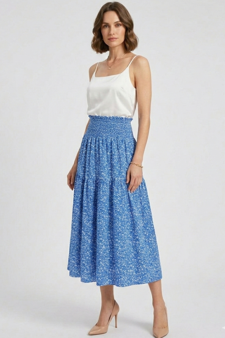 Front view model in floral midi blue skirt and white top in gray background