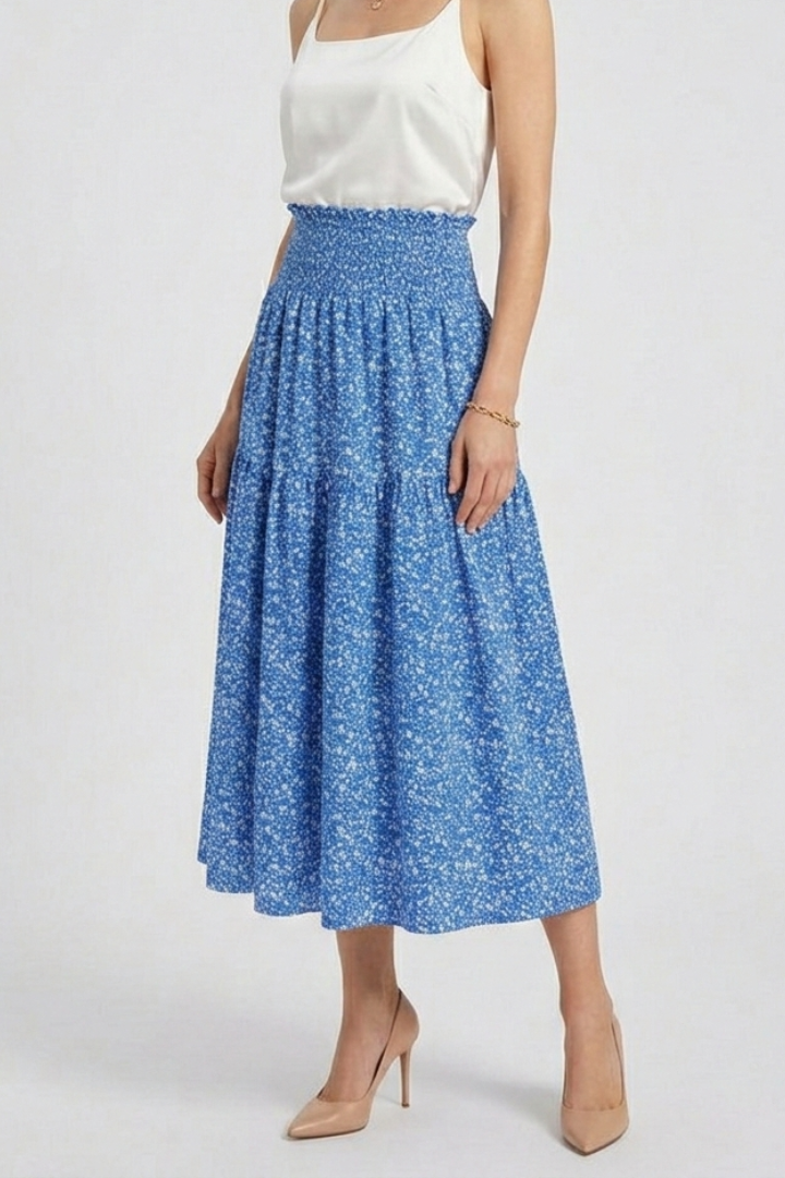 Close up waistband elastic blue skirt gray background