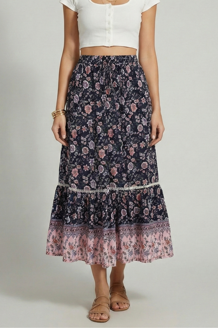 Full body model in printed skirt gray backdrop