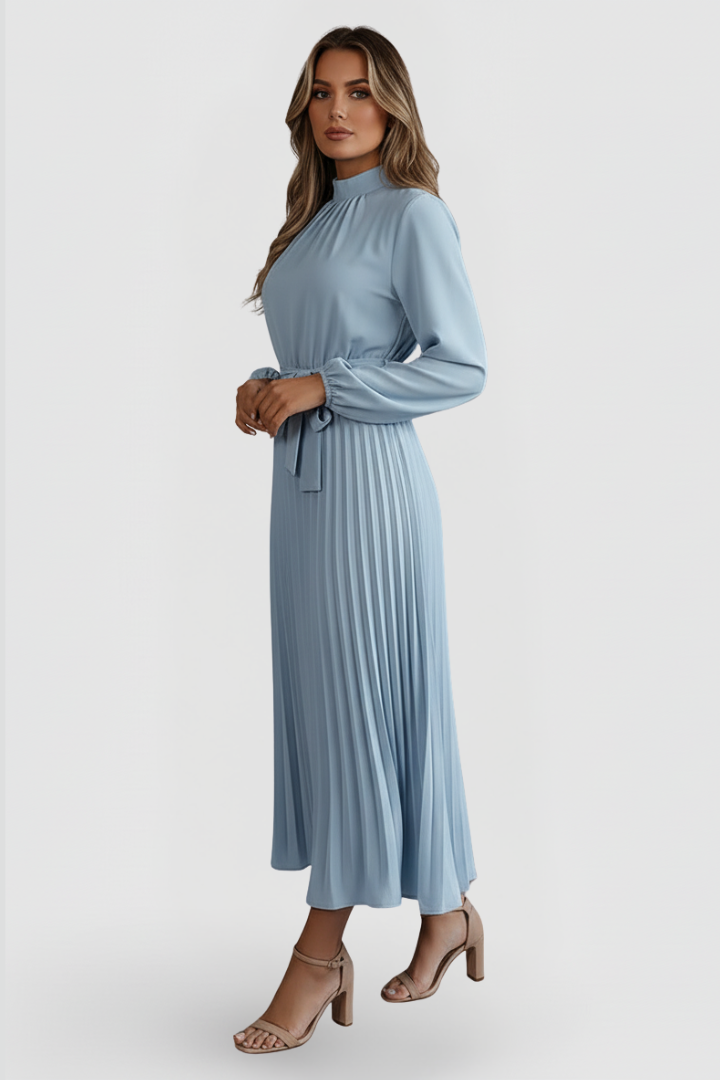 Female model wearing belted long dress with pleated skirt