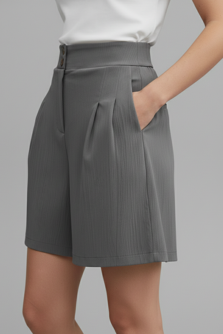 Female model side pose in wide leg shorts with pockets