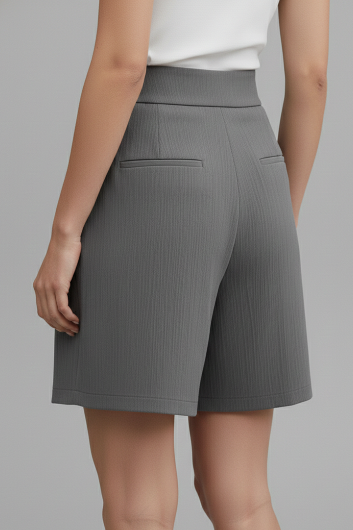 Back view of knee length shorts gray background