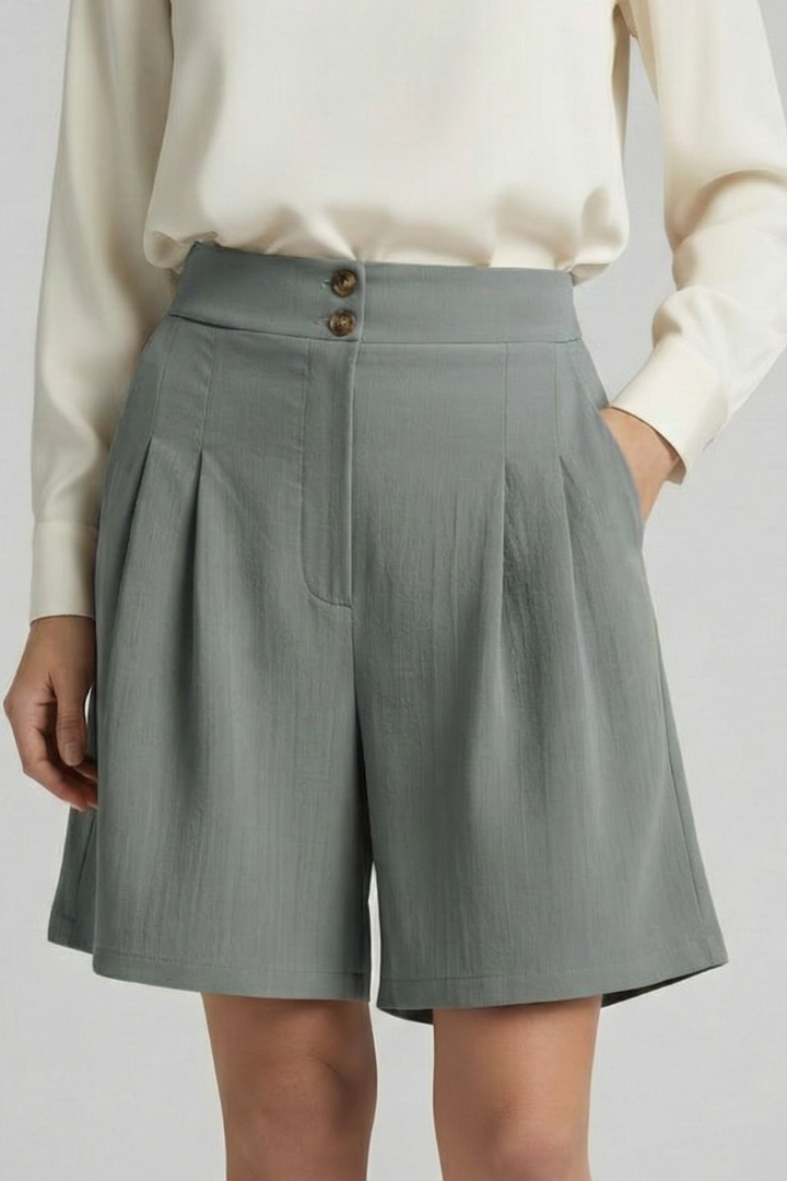 Front angle loose fit gray shortd with pockets on plain background 