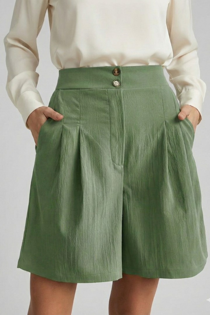 Model subtle pose on green, gray background knee length