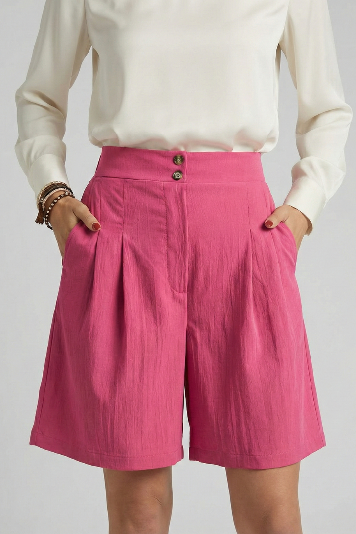 Woman front standing trendy pink shorts with white top