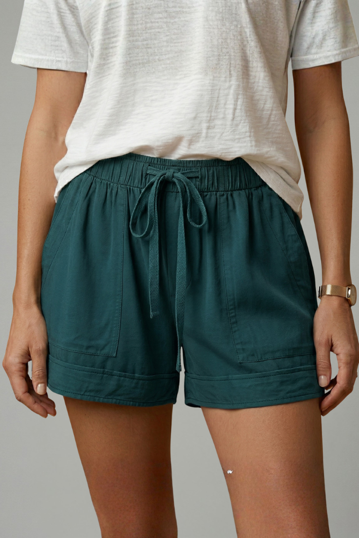 Model studio pose in casual shorts
