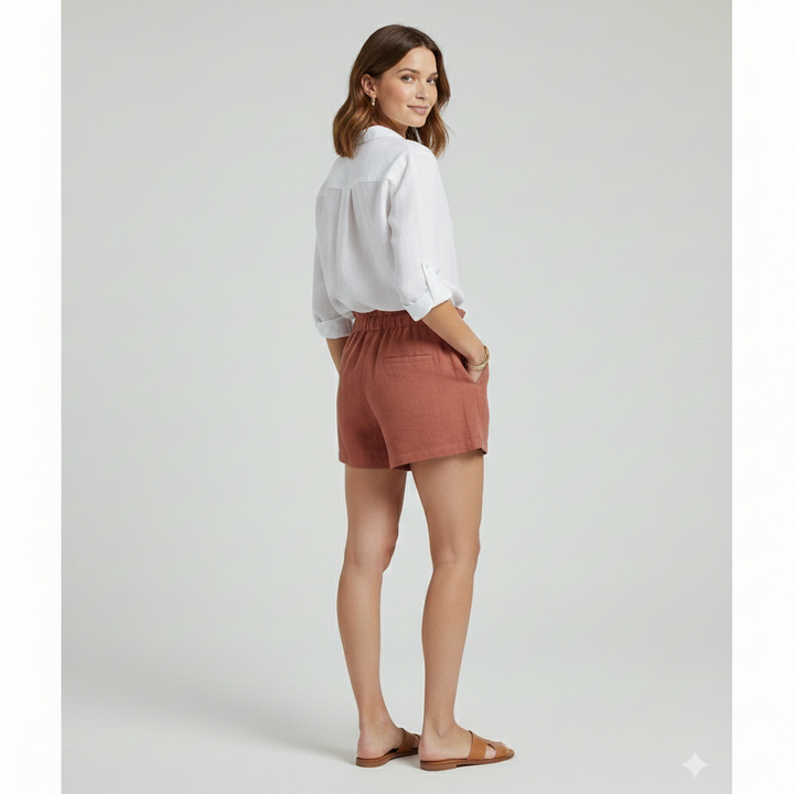 Female model back posing in short relaxed woven red shorts