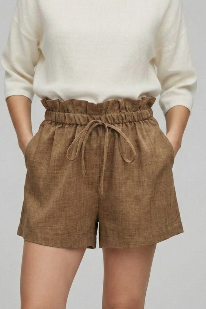 Woman wearing pocket shorts studio shot