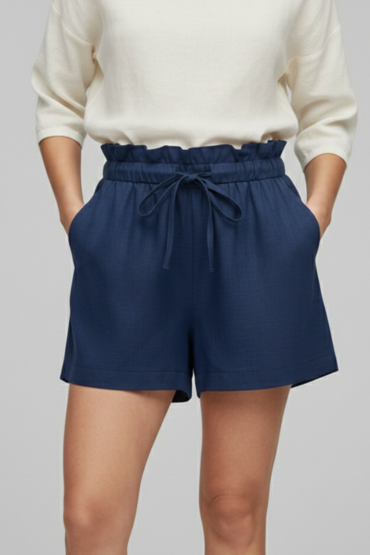 Front view navy blue drawstring shorts on female model gray backdrop