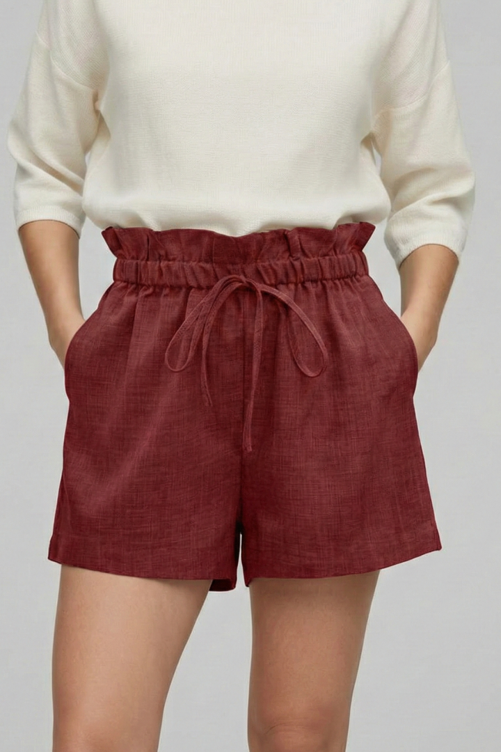 Elastic waist shorts modeled on gray background