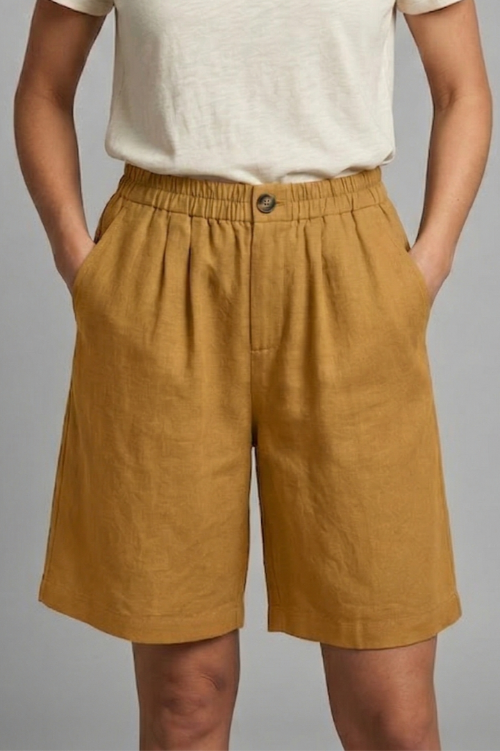 Model wearing plain casual shorts, front view