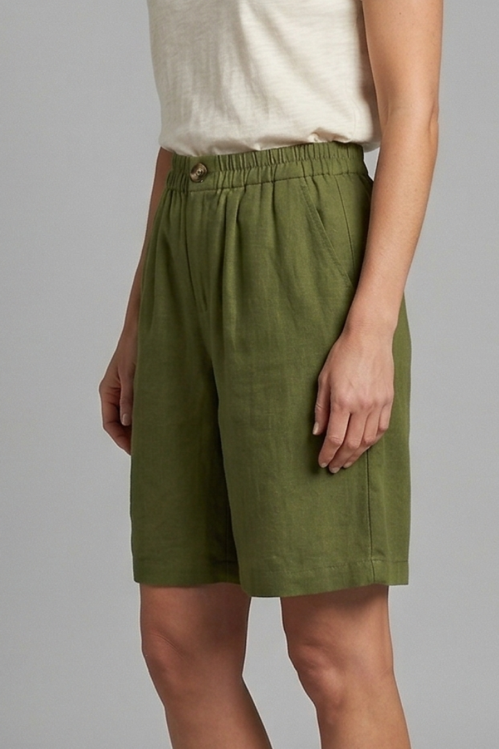 Female model wearing woven shorts, straight hem