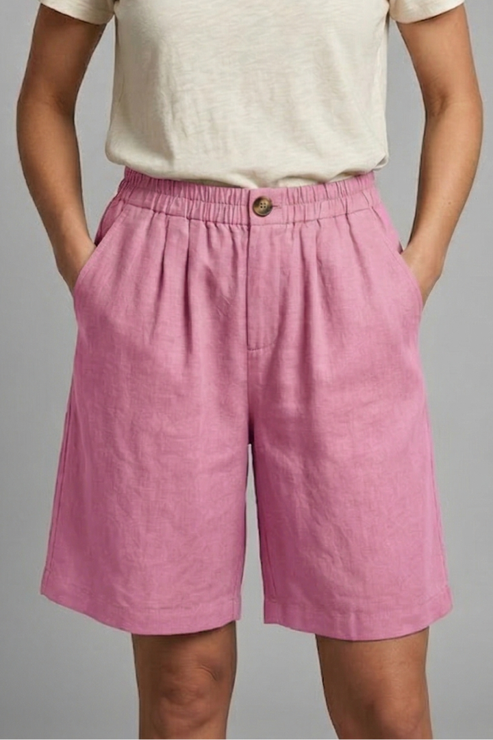 Women’s casual pink shorts side picket front view, gray background