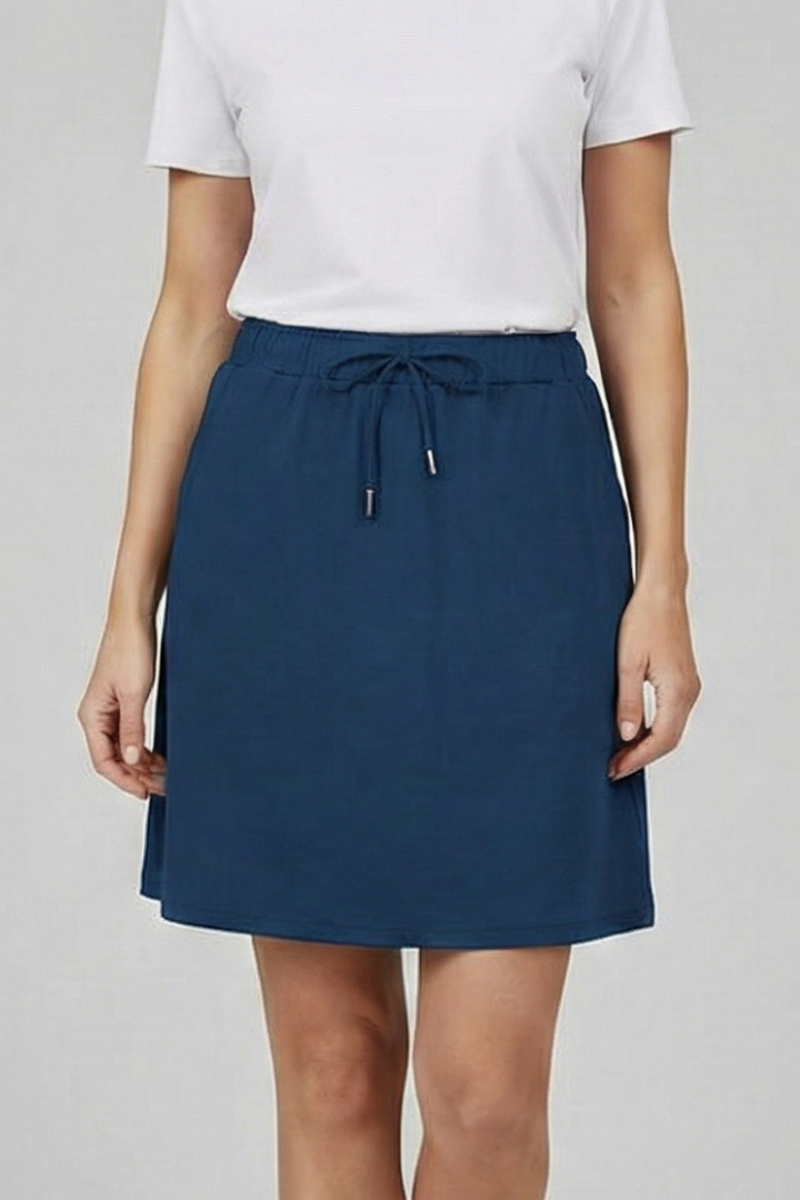 Female model front pose skirt, plain gray background