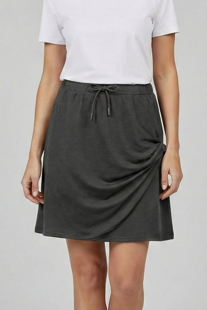 Female angled back black skirt with drawstring