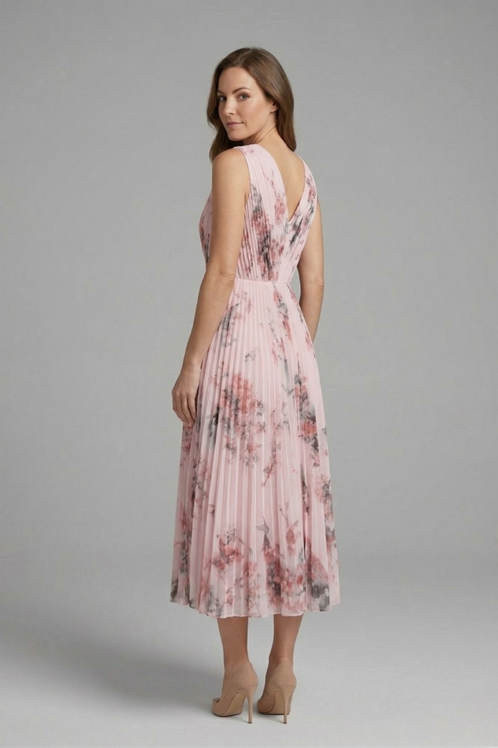 Back view of pleated floral midi dress with heels