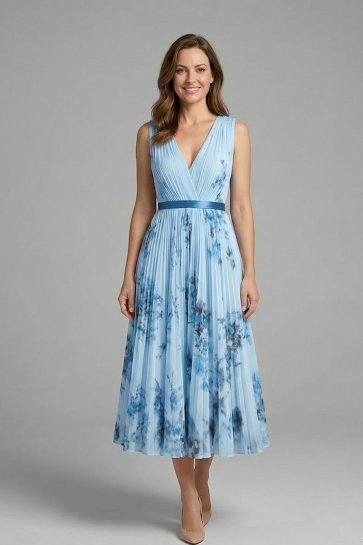 Flowing pleated skirt blue dress on model with heels