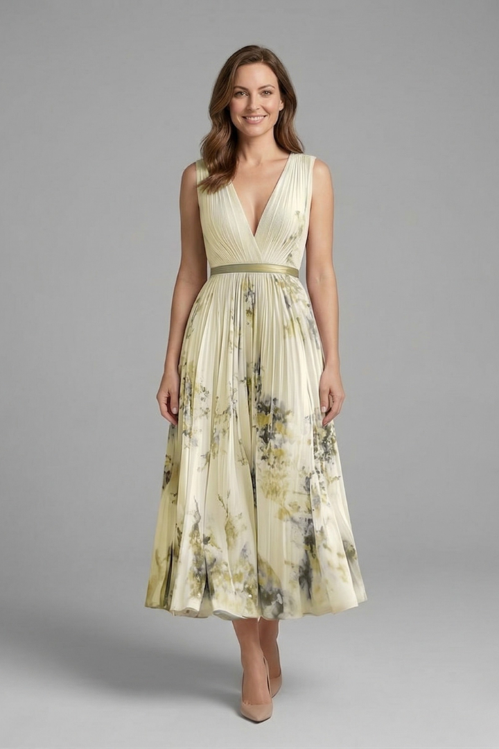 Model showcasing fitted waist dress front angle