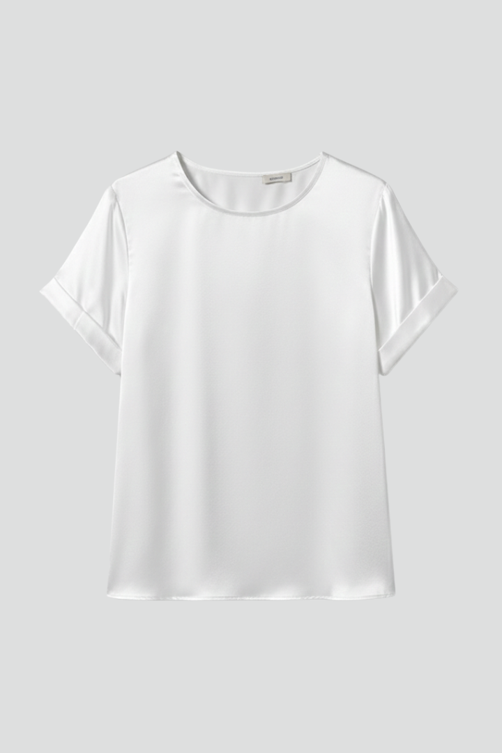 Women’s white short sleeve tee on plain background