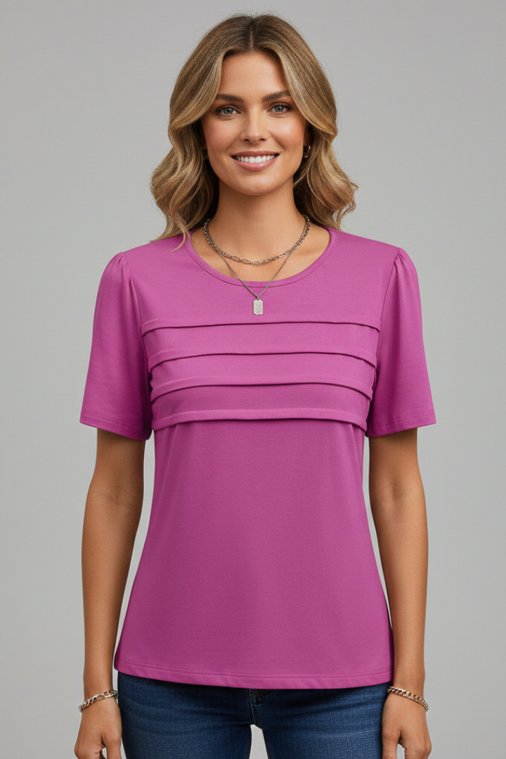Front view model in pink top with layered detailing