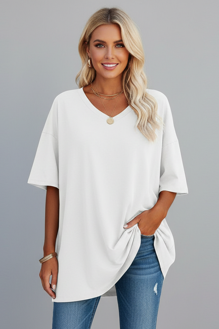Model in white short sleeve shirt gray backdrop image