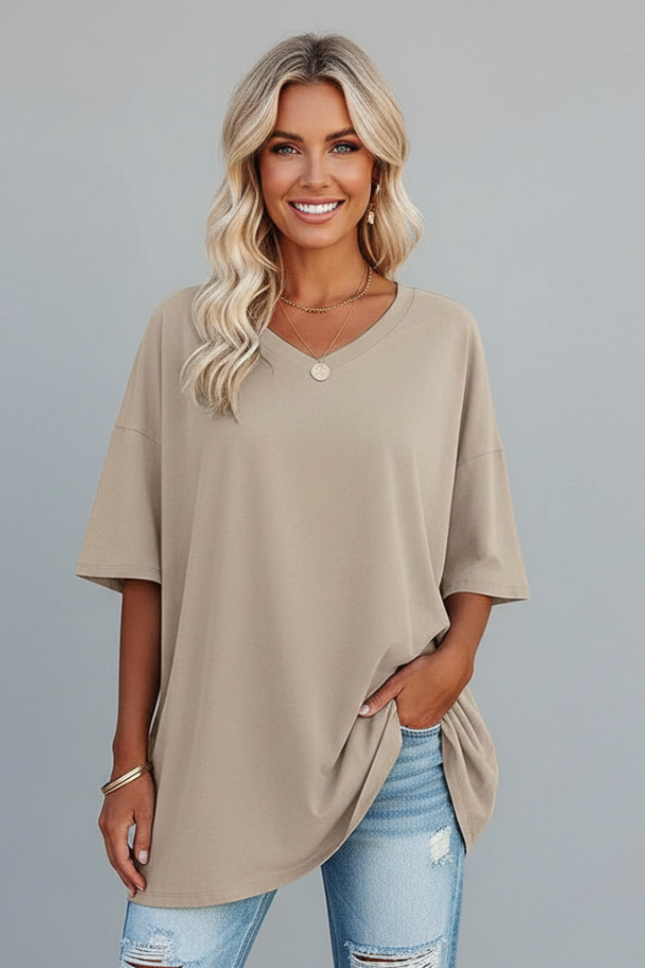 Female in short sleeve casual top studio gray background