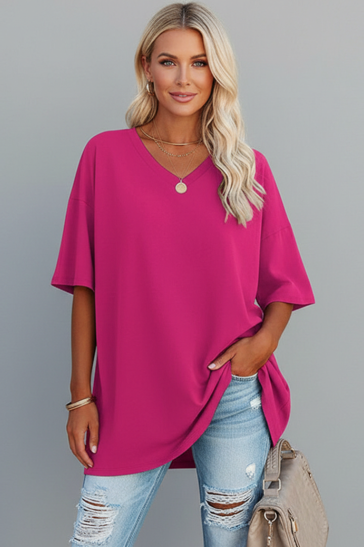 Pink tee wear by woman model centered gray background