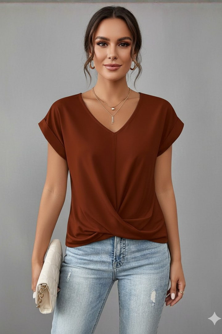 Woman in loose short sleeve top front view grey background