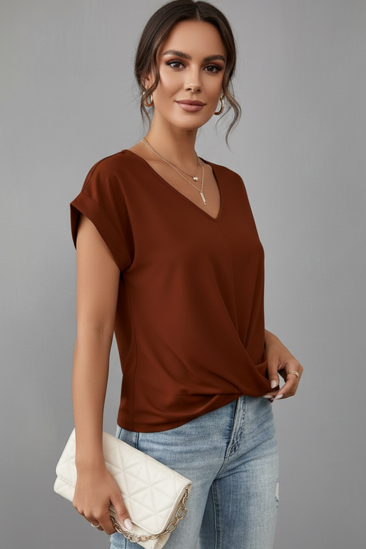 Casual women’s V-neck blouse side angle studio image
