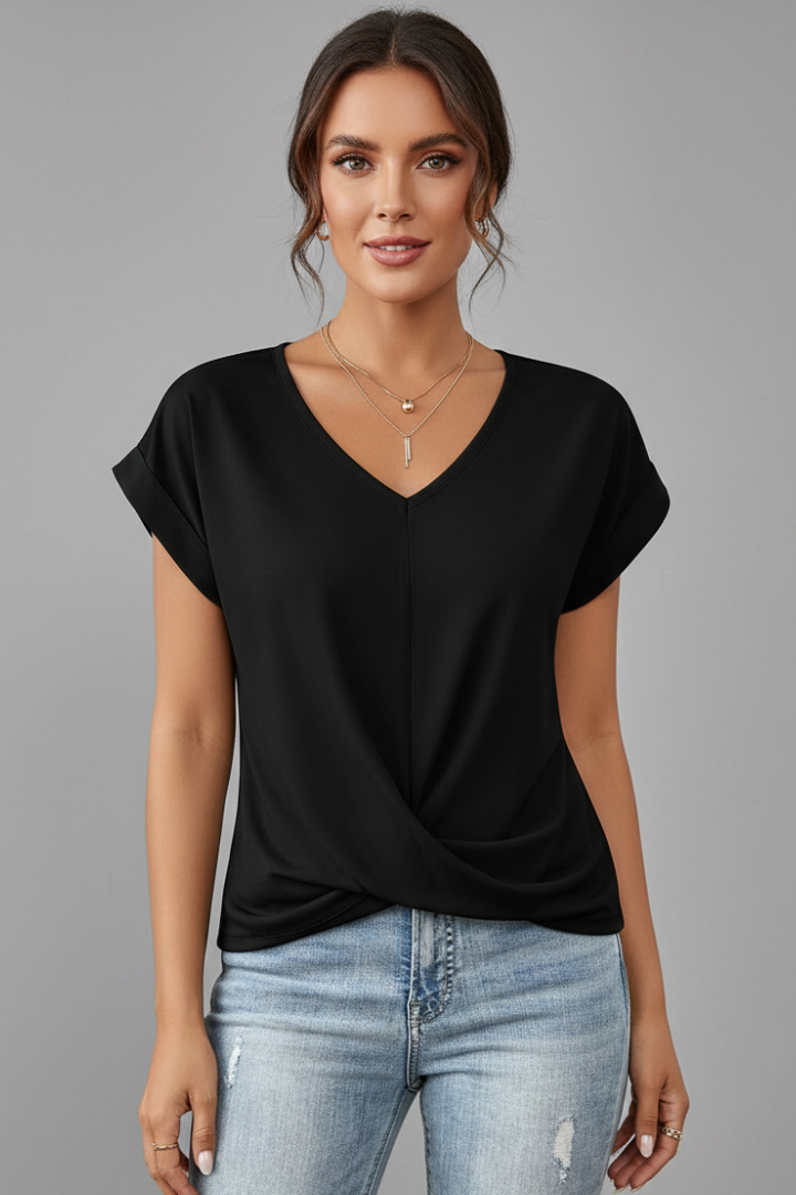 Female model in loose women’s fashion black shirt front shot gray backdrop